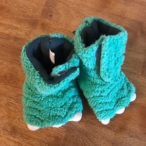 Fuzzy dinosaur slippers